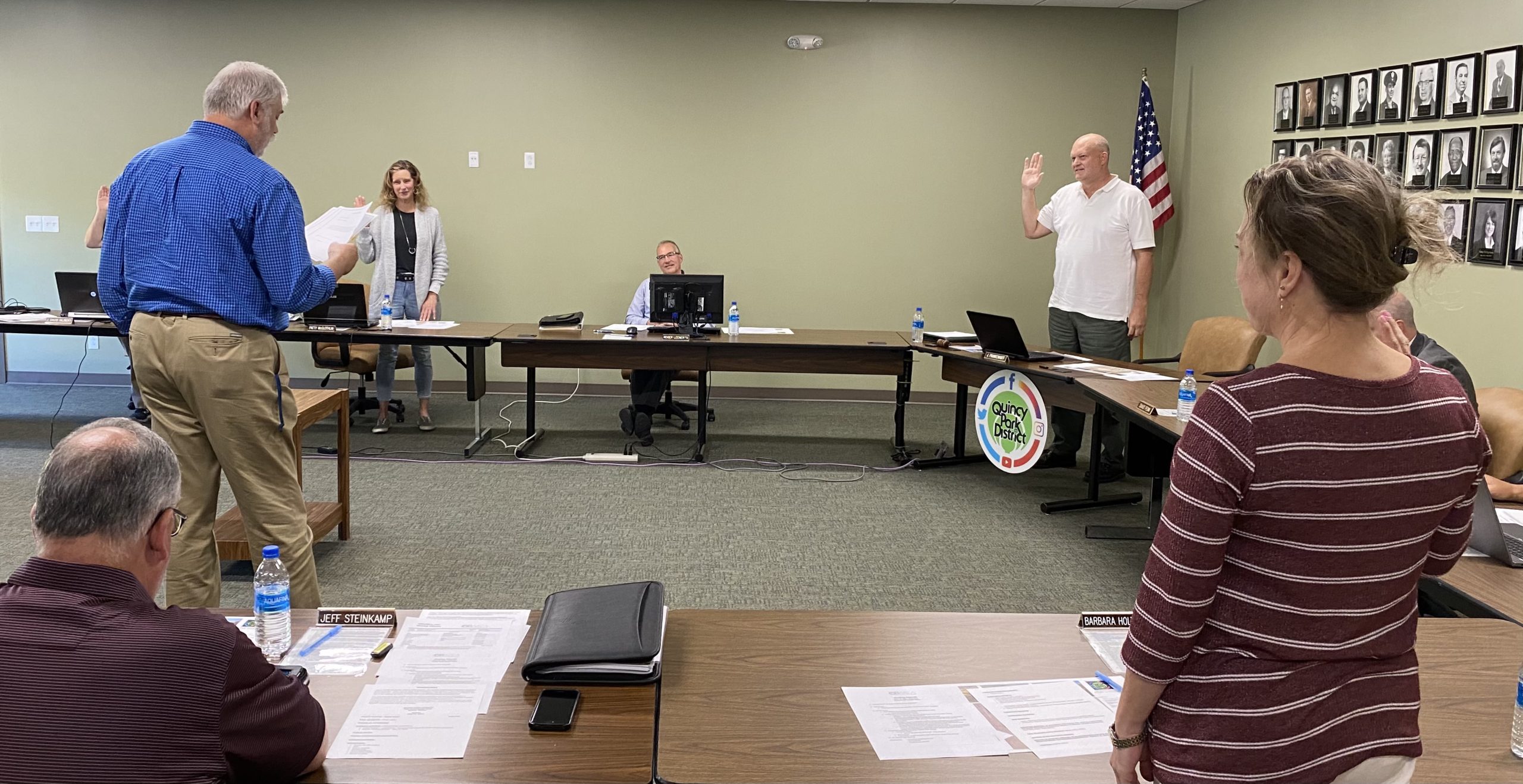 Don Hilgenbrinck, director of business services, swears in members of the Quincy Park District's Board of Commissioners during its May meeting on Wednesday, May 12. Standing are Patty McGlothlin, left, and John Frankenhoff, while Barb Holthaus has her back to the camera. Seated is Roger Leenerts, who was elected as the board president during the meeting. Also sworn in as a commissioner was J. David Gilbert, not pictured.