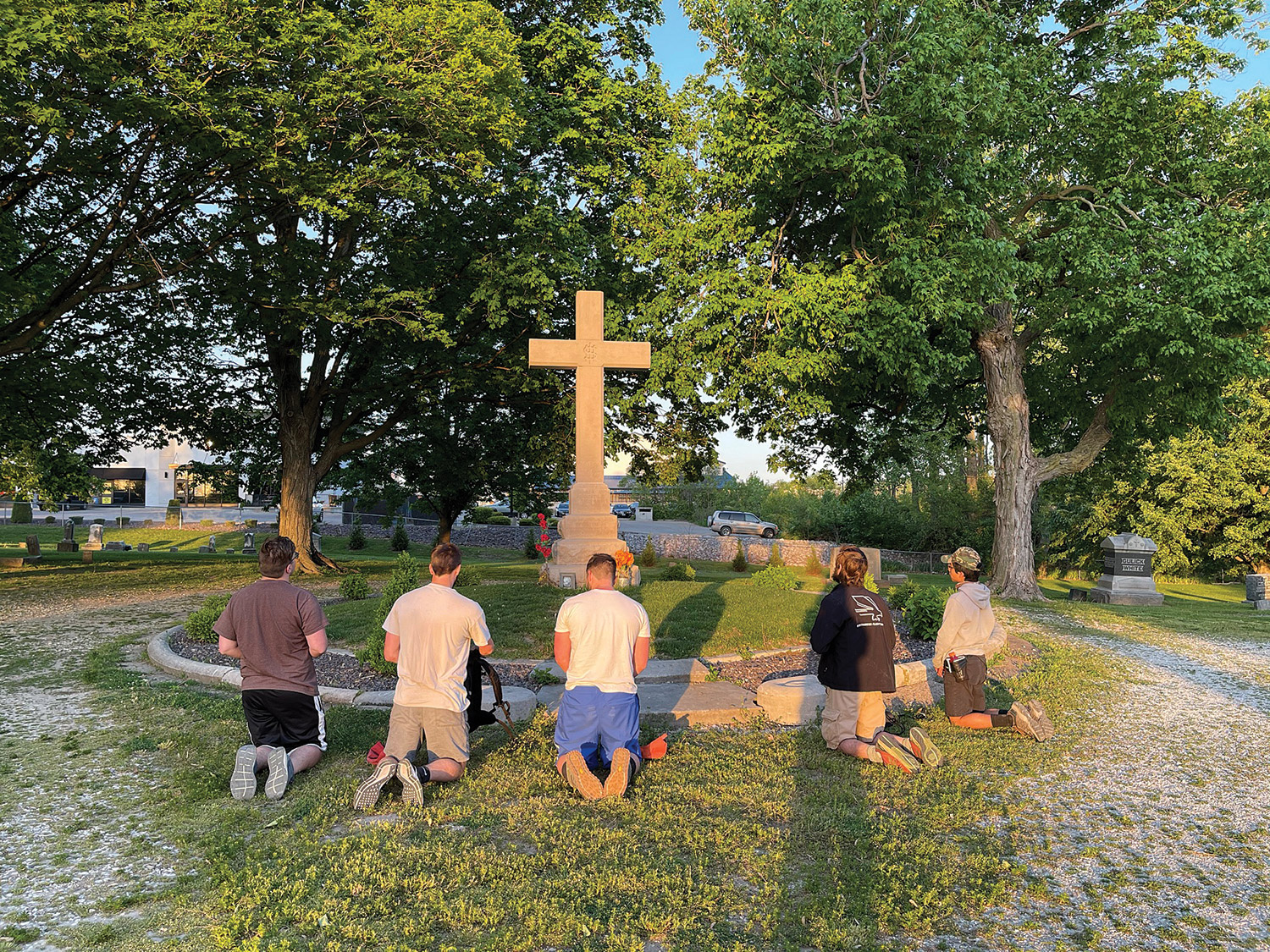 06-13-2021-QU-students-kneel-Tolton-grave