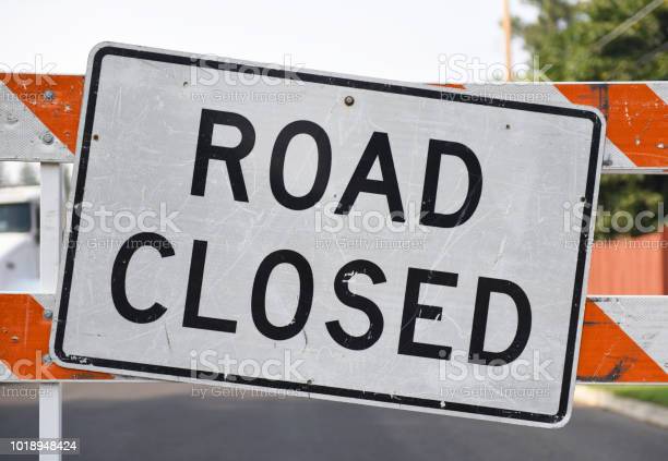 Horizontal shot of a road closed sign.