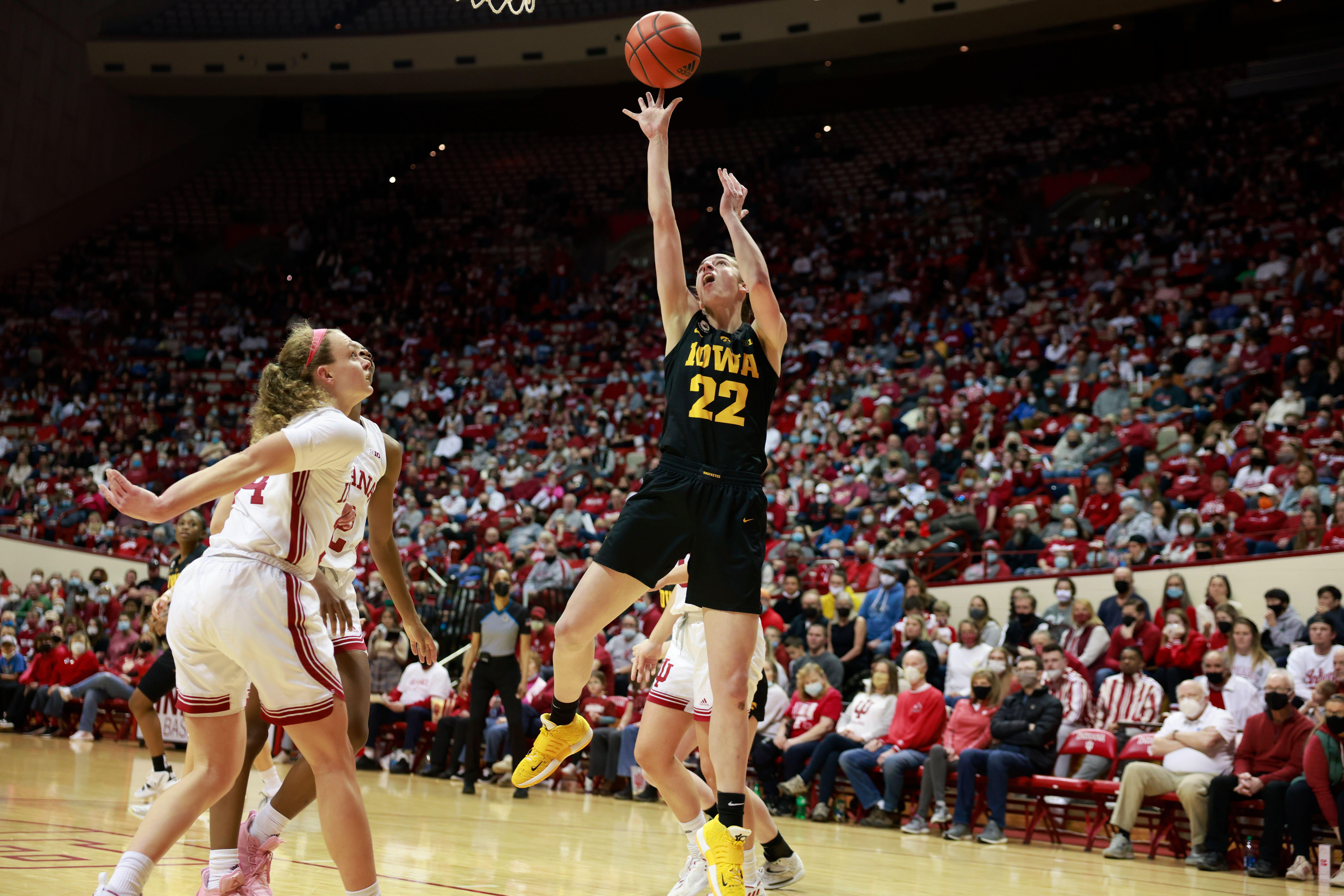 2HPB1BA Bloomington, United States. 19th Feb, 2022. Iowa Hawkeyes guard Caitlin Clark (22) goes to the basket against Indiana University during an NCAA women's basketball game in Bloomington, Ind. The Iowa Hawkeyes beat the Indiana University Hoosiers 96-91. Credit: SOPA Images Limited/Alamy Live News