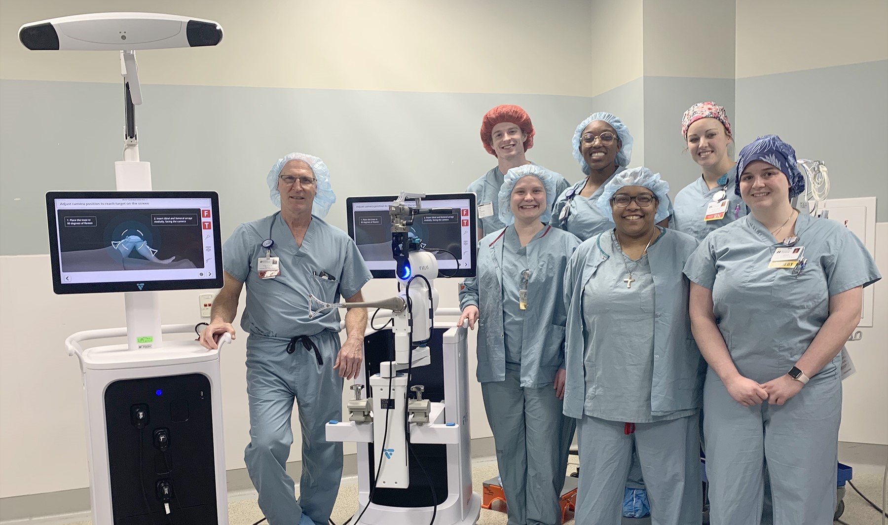 Dr Darr Luetz with the Velys knee replacement system and surgical team