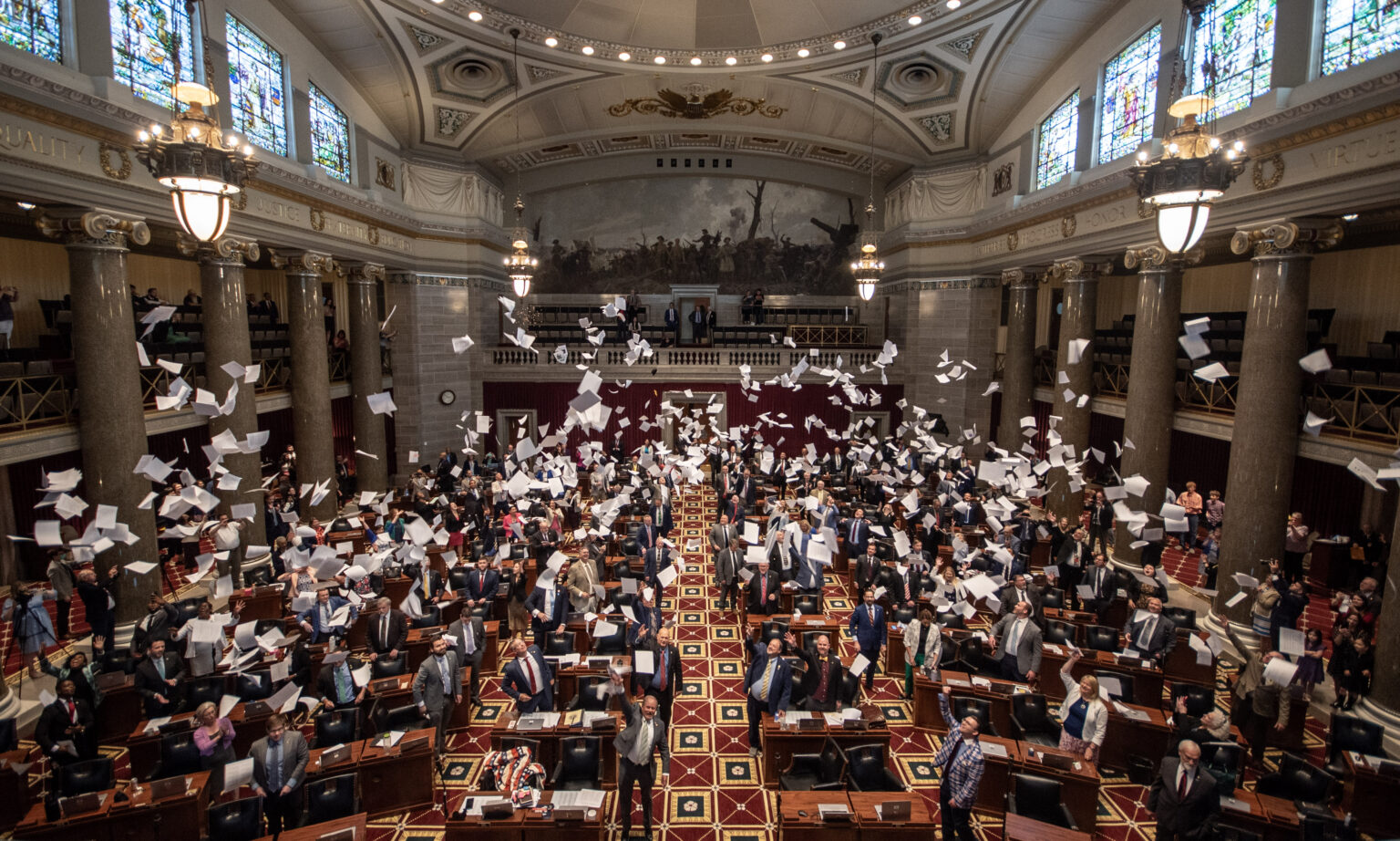 The Missouri House of Representatives commemorates the end of the 2024 legislative session by tossing hard copies of bills into the air upon adjournment (Annelise Hanshaw/Missouri Independent).