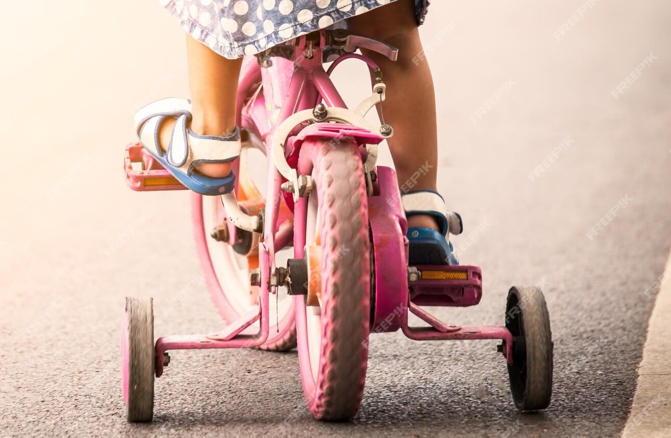 low-section-girl-cycling-road_1048944-9365771