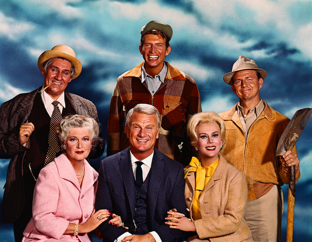 (Original Caption) Publicity photo of the cast of Green Acres left to right: Pat Buttram as Mr. Haney, and Tom Lester as Eb Dawson, Alvy Moore as Hank Kimball (seated), Mother on series (unidentified), Eddie Albert as Oliver Douglas and Eva Gabor as Lisa Douglas.