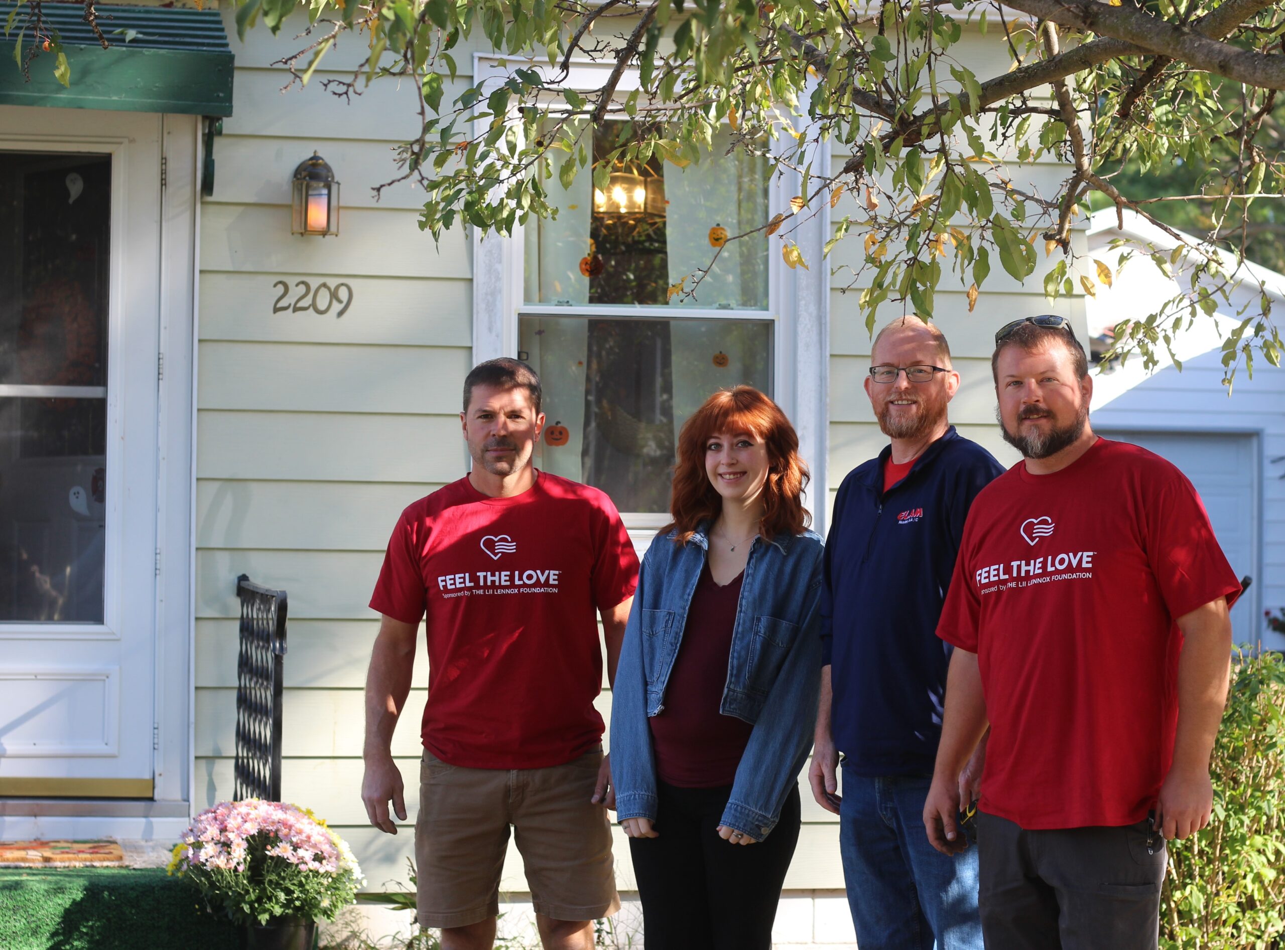 (From left to right) Nick Logsdon, Ella Wiemelt, John Hultz and Nate Cannell stand in the front yard of Wiemelt’s house on Tuesday morning. Wiemelt was nominated by the Elam Heating &amp; Air Conditioning, owned by Logsdon and Cannell, to receive a free HVAC system, which was installed in her home Tuesday morning. 