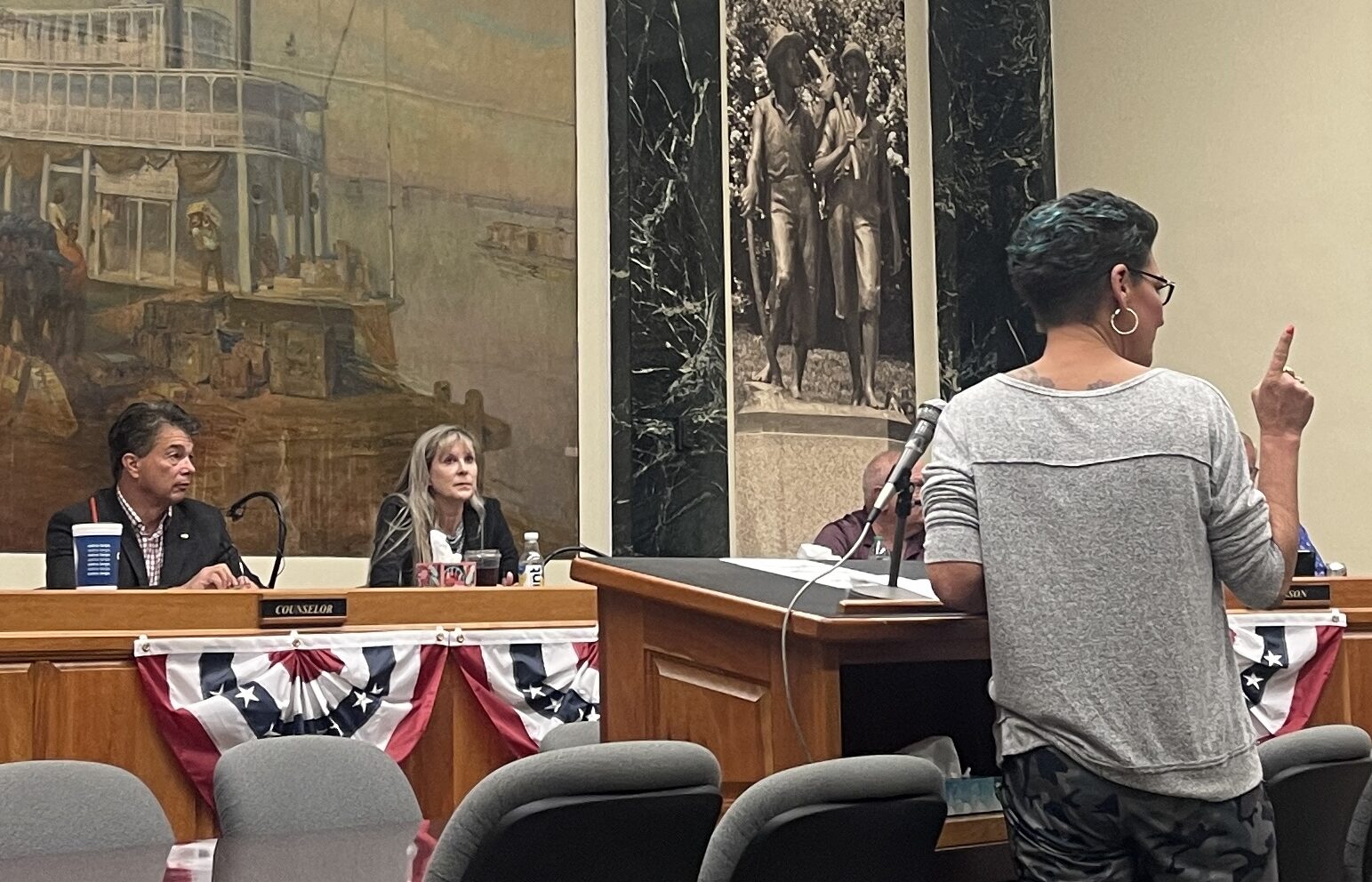 Lisa Latta, right, raises a finger at Mathew Munzlinger, the director of operations for the Hannibal Board of Public Works, for communication discrepancies regarding construction in front of her bar, Tipsy Bricks.