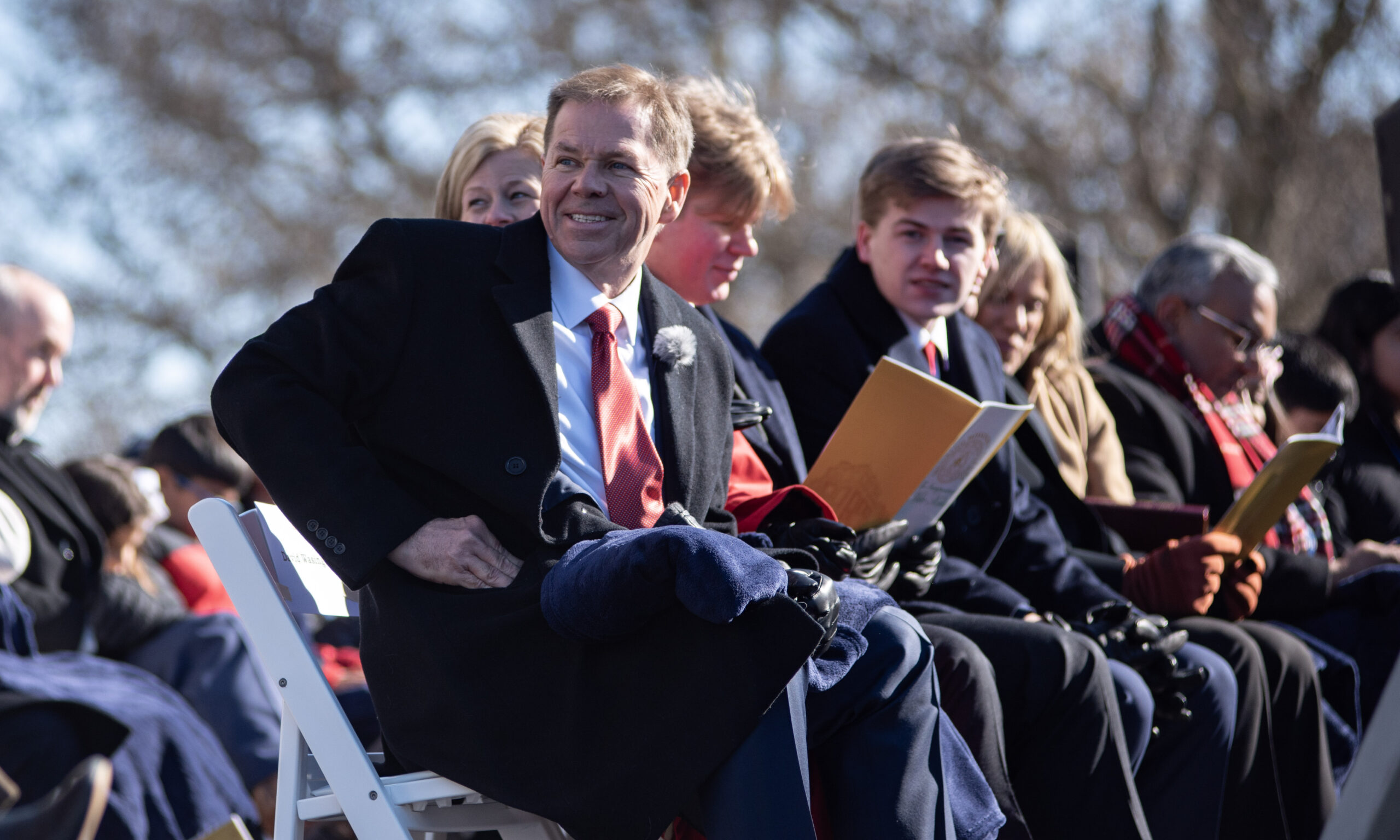 Missouri Lieutenant Gov. David Wassinger sits with his family on stage during the inauguration ceremony Monday (Annelise Hanshaw/Missouri Independent).