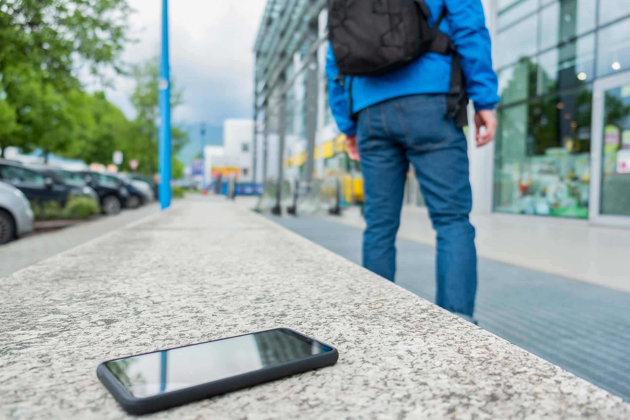 person-forgot-phone-on-bench