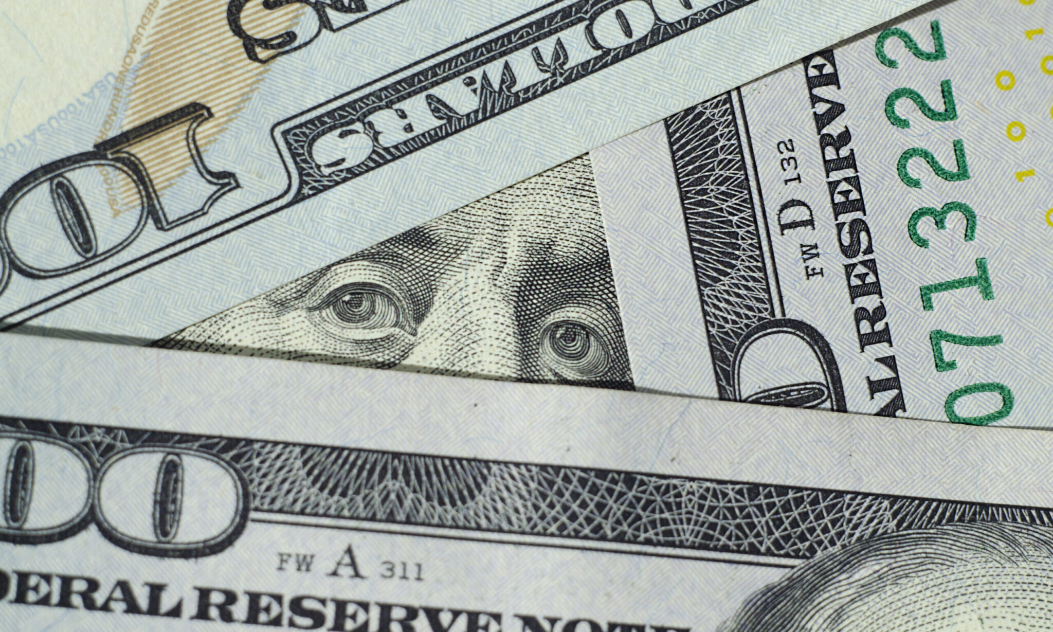 Macro photo of banknotes of money in the US currency one hundred dollars. 100 US dollars. Macro photo of banknotes of money in the US currency one hundred dollars.
